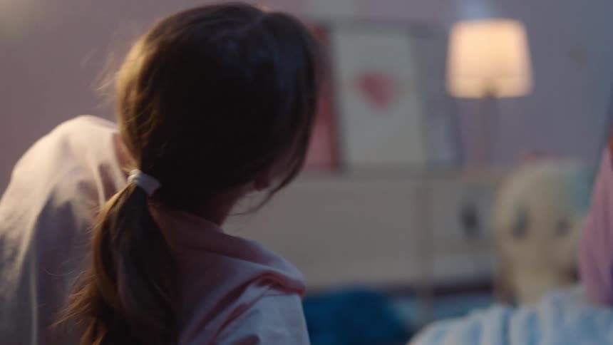 Two friends talk in the bed