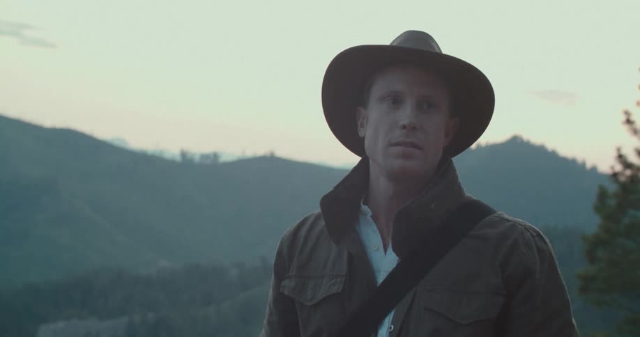 Man in hat walking outdoors