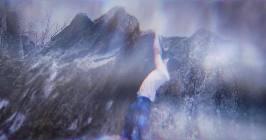 Man climbing a rock dangerously