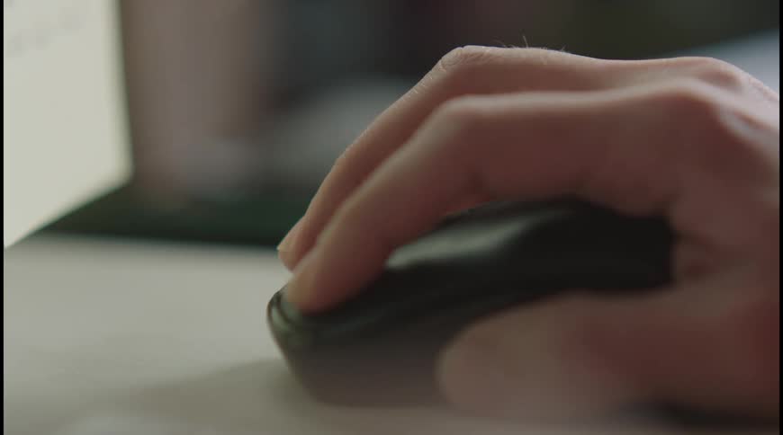The person is pressing the button on the mouse