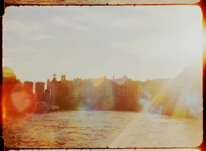 Classic city with sun reflection on the seashore