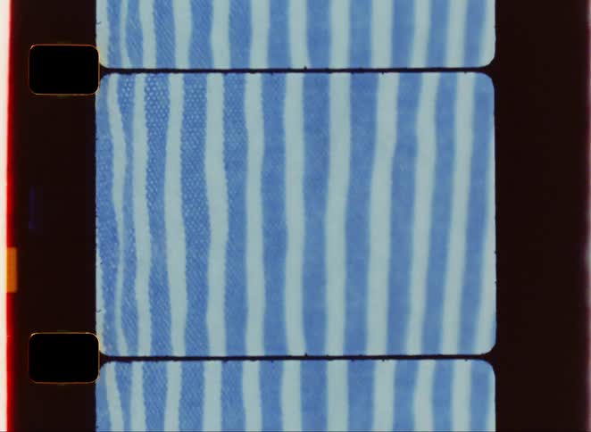 A piece of clothing with a blue and white striped pattern is shown in the rectangular frame of a film strip