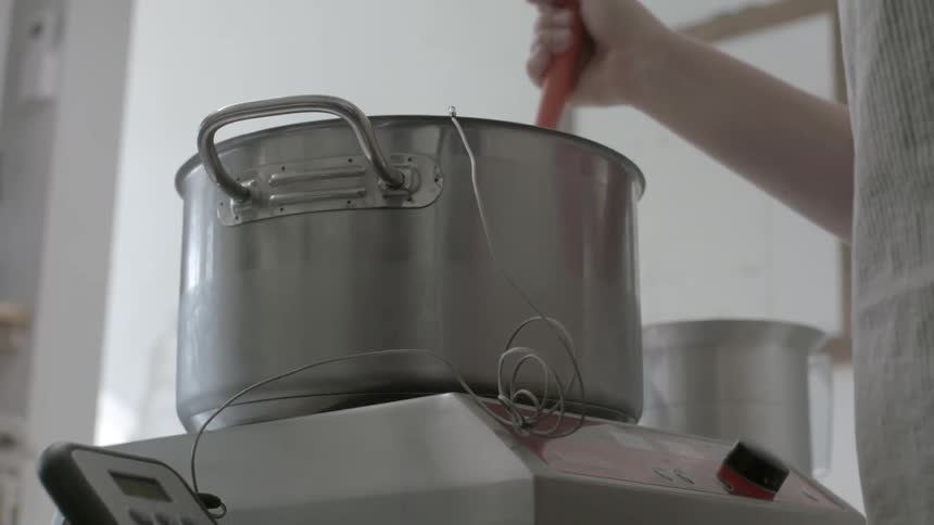 A woman stirs batter in a bowl