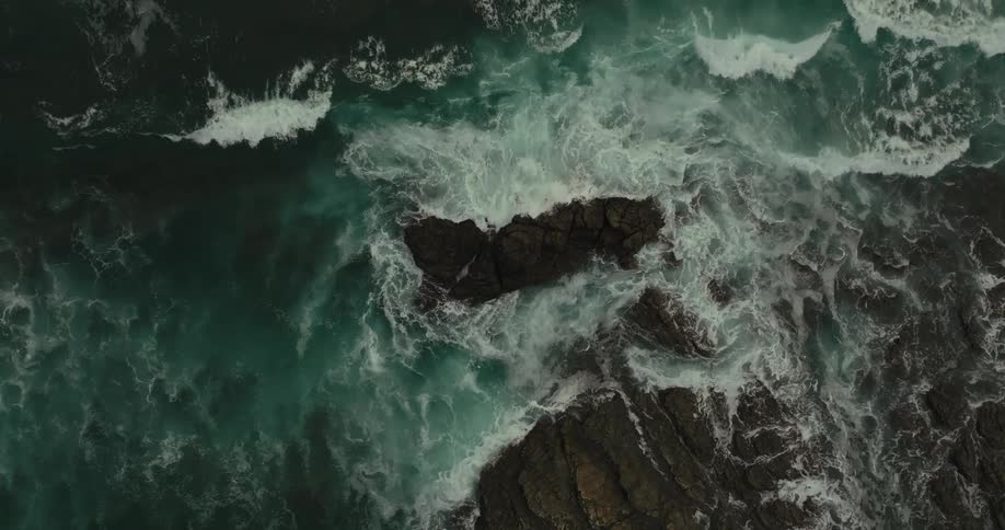 Waves crash against the rocks