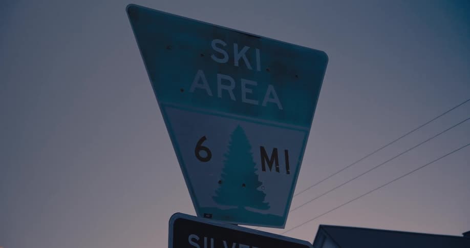 The sign is posted on a cloudy day