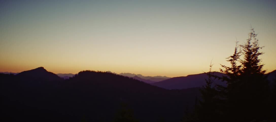 A silhouetted land at dusk