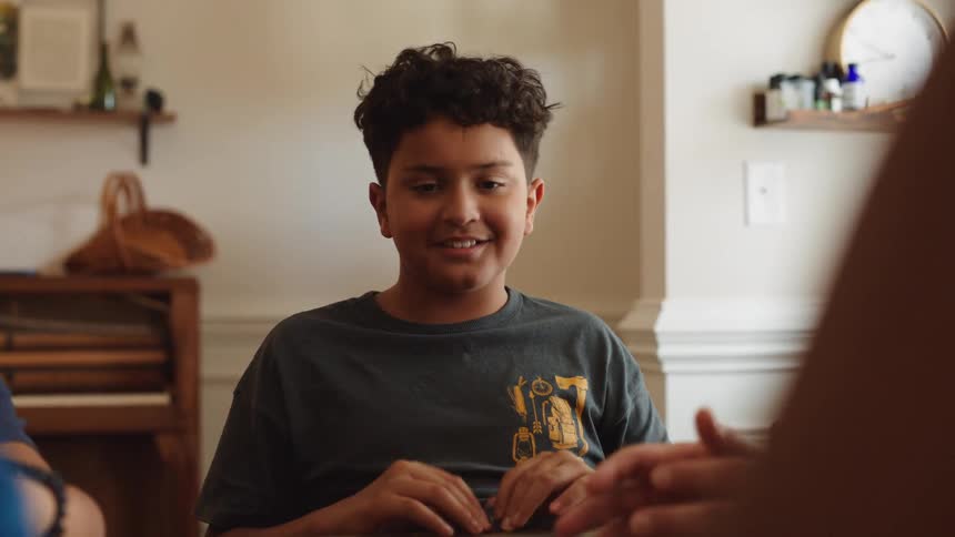 Boy sitting at the table talking