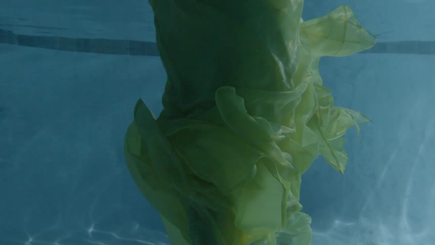 A woman bobs with just her head above water