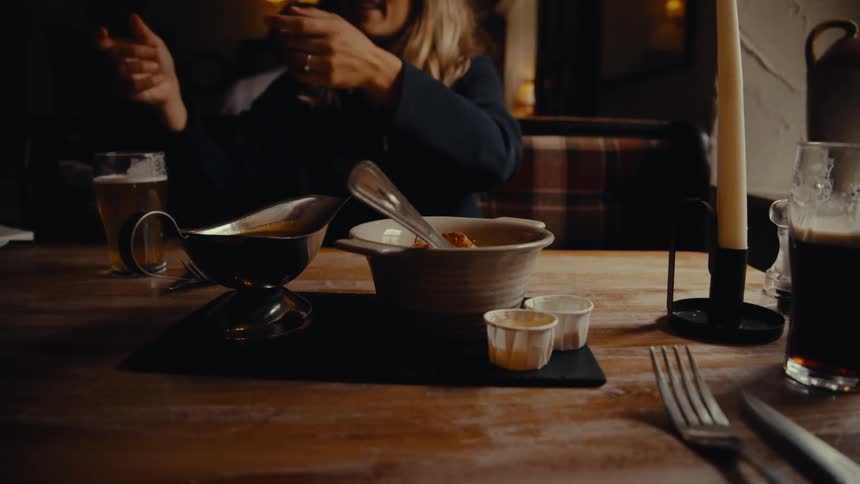Waiter serving dishes in a restaurant