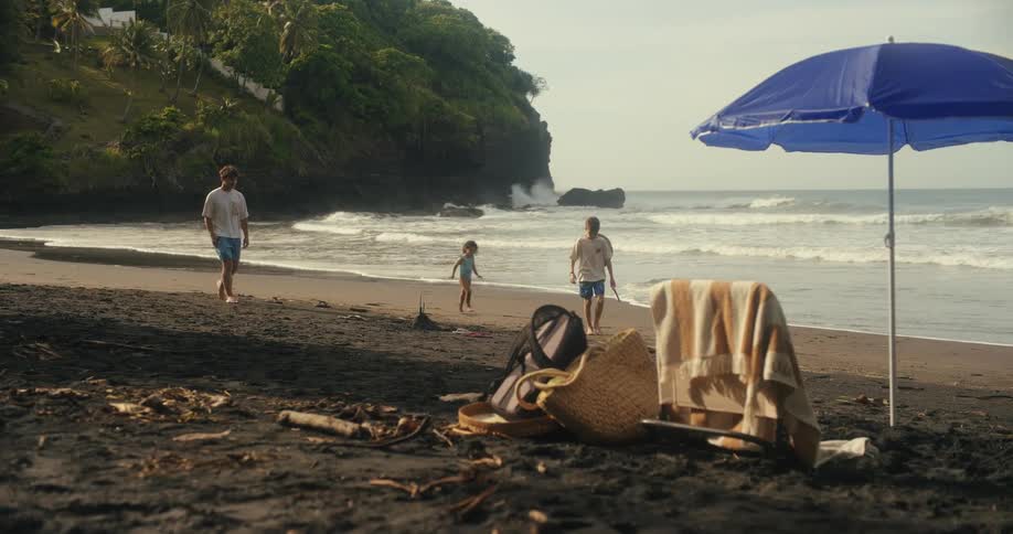 Children walk on the beach together