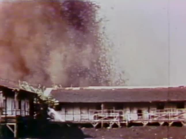 Liquid and ash spews into the air