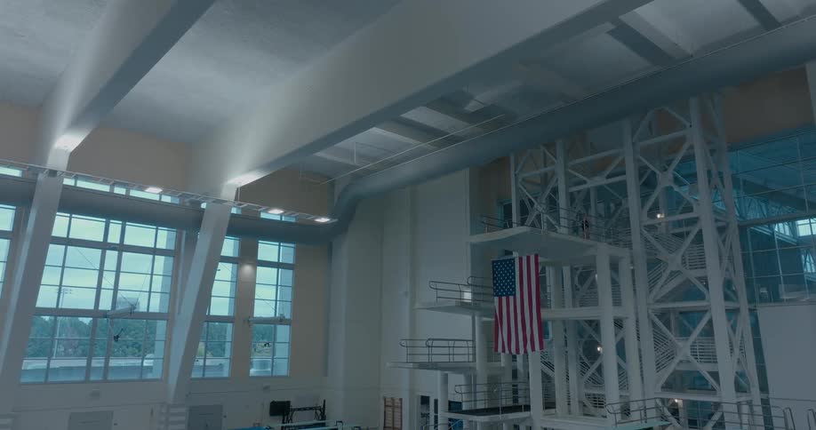 Interior structure of the georgia tech diving pool with platforms and a hanging united states flag