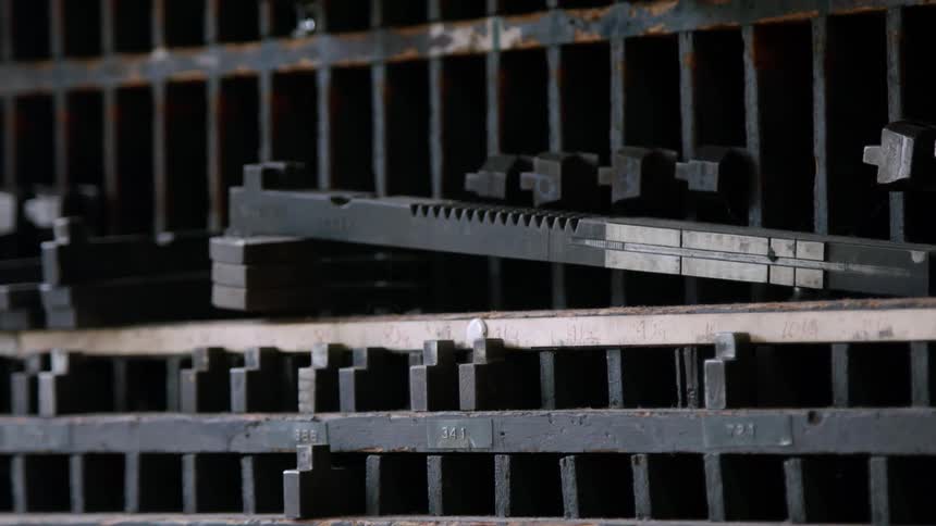 Metal movable types organized in compartments used in letterpress printing