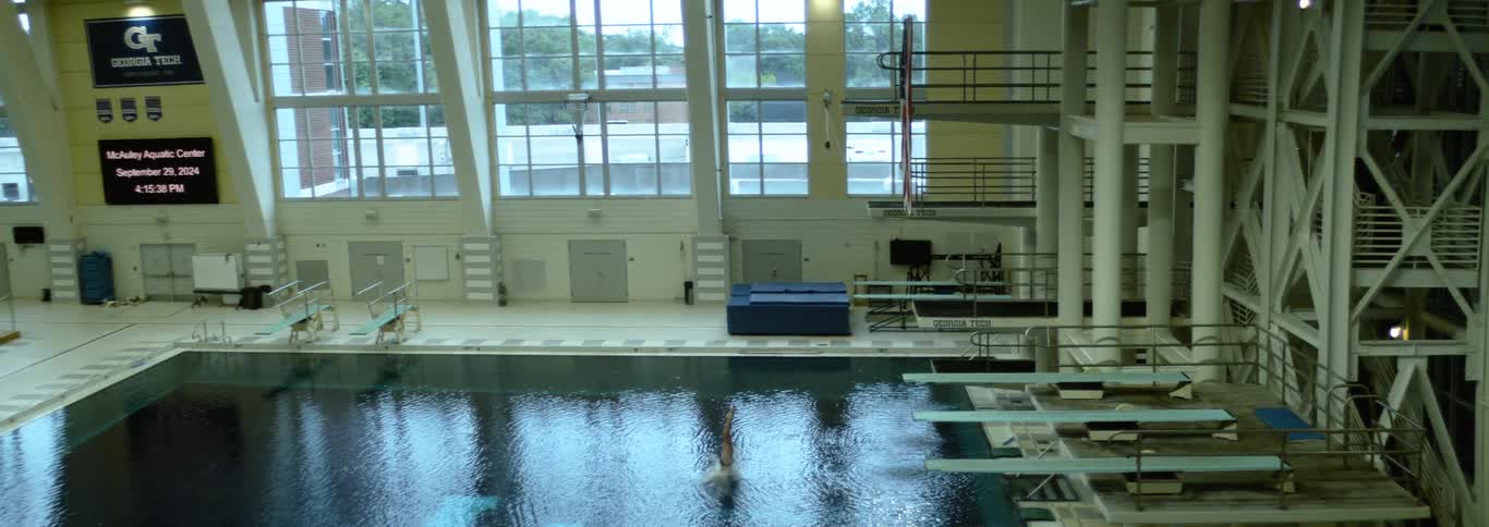 The man is diving into the pool