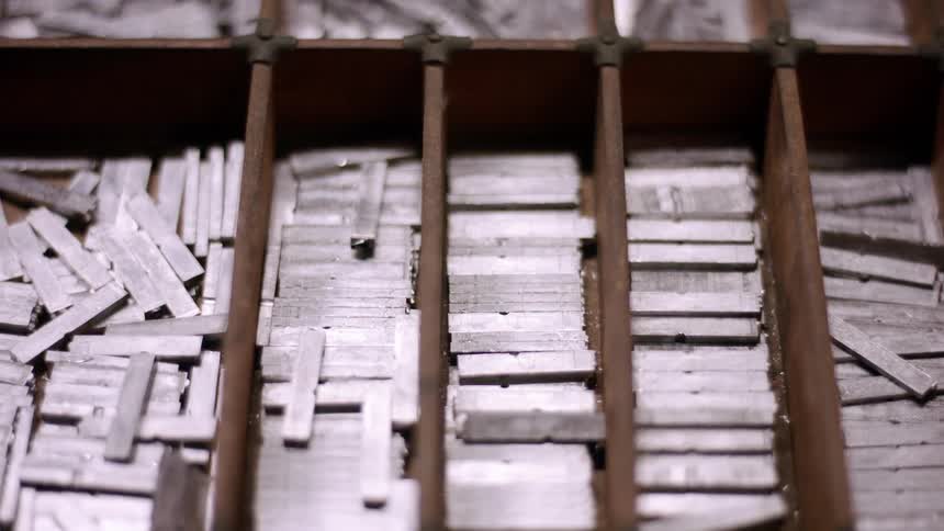 Wooden compartments store metal pieces used in typography