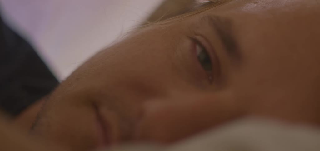 The man wakes up and laughs