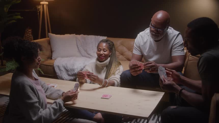 Friends play cards together