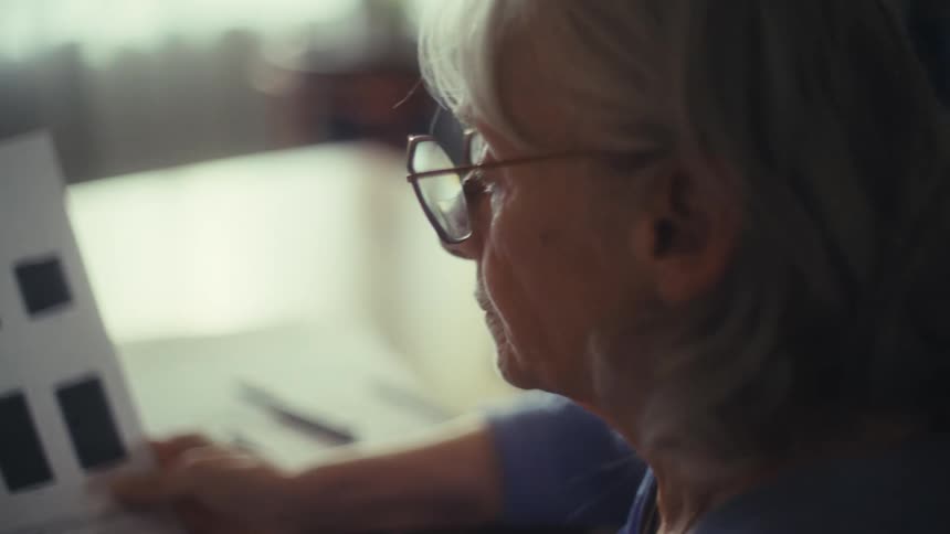 A man and woman discuss paperwork