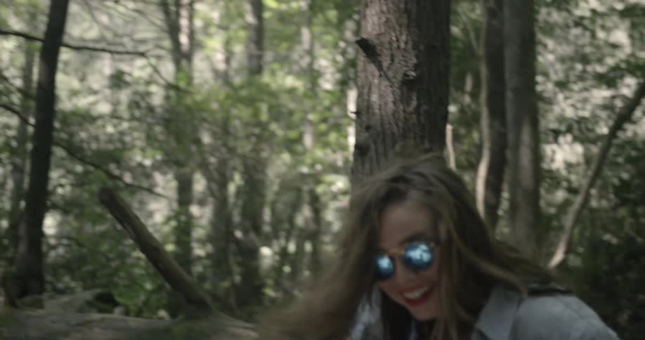 A woman gets a piggyback ride and smiles