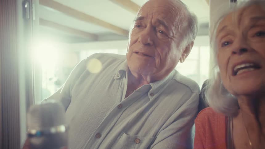 Elderly couple reacts with surprise