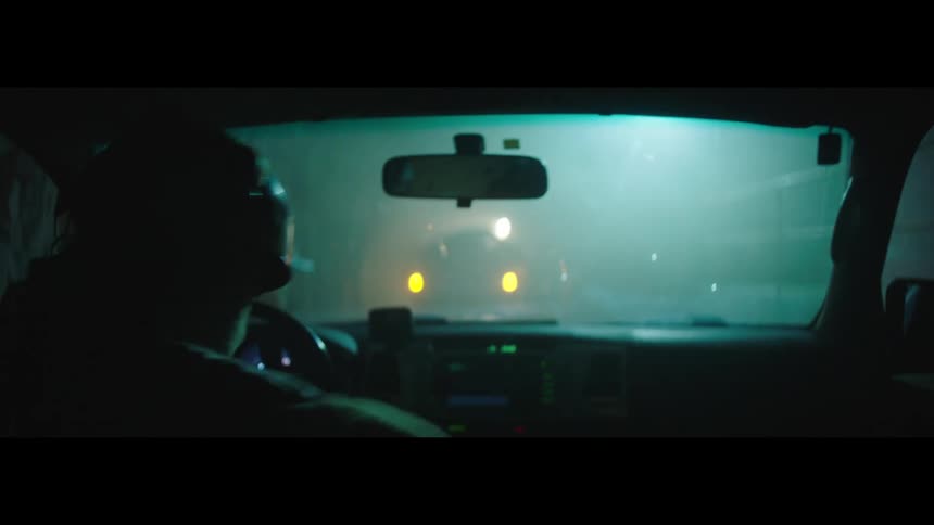 A soldier with a rifle and military gear gets off the car at night and go along with two other soldiers with rifles