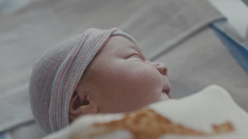 Newborn baby lying down sleeping