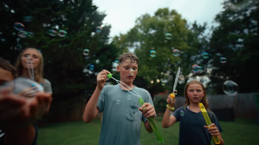 The children bubbles in the yard