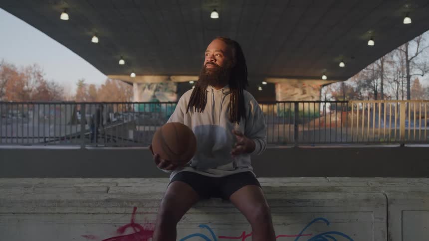 A man holds a basketball