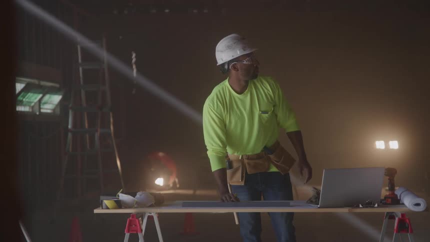 Man working on a construction site table