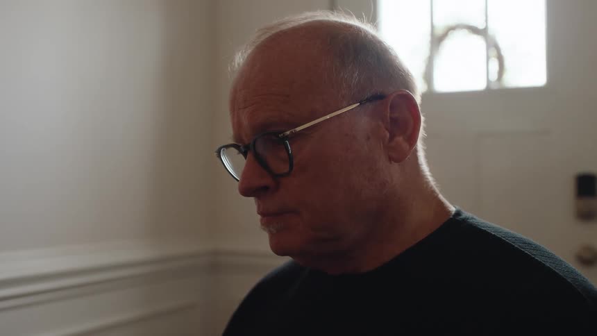 Man with glasses sitting concentrated