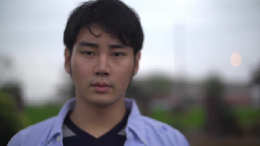 Man walking forward on a cloudy day
