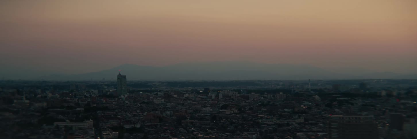 City skyline at sunset with an orange sky