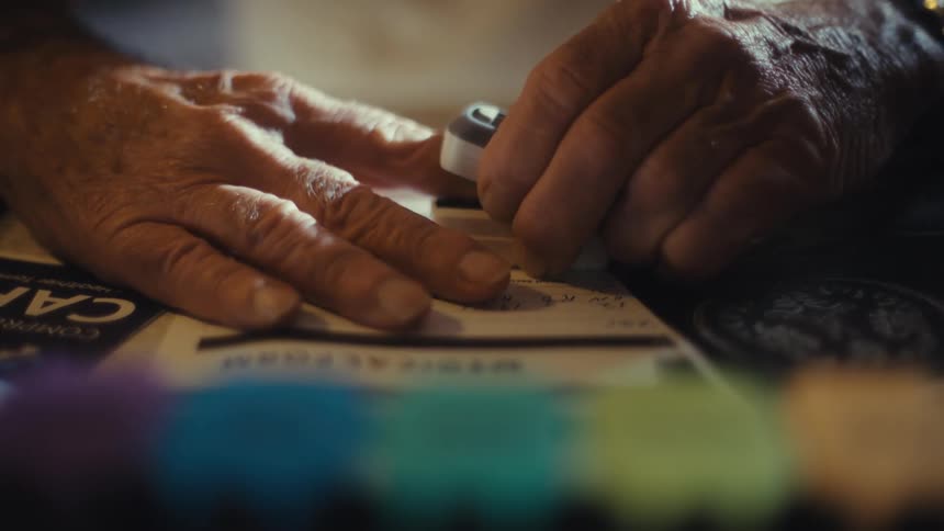 The man attaches a medical monitor at home