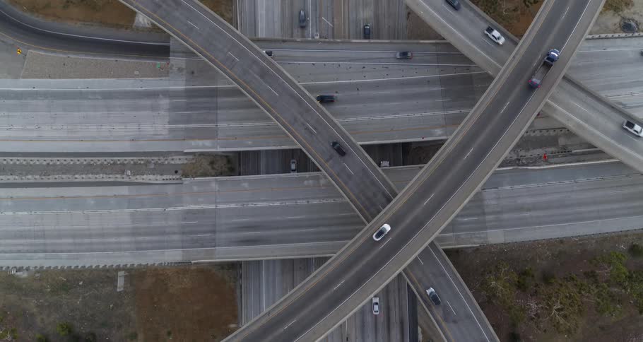 Vehicles travel along the multiple levels of a network of highways