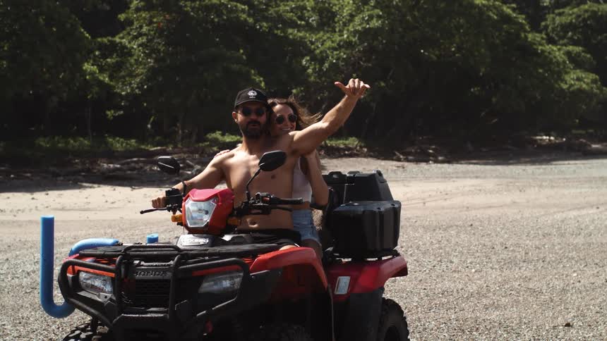 Couple having fun riding a buggy