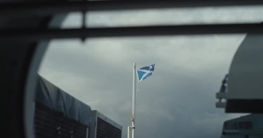 A blue flag waves in the breeze