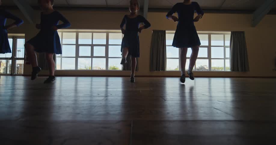 Girls dance together in sync