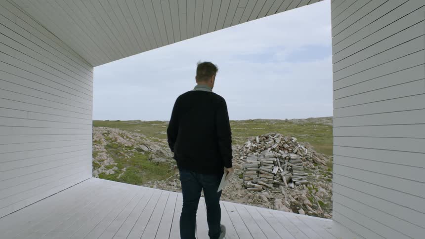 A man walks through a hall