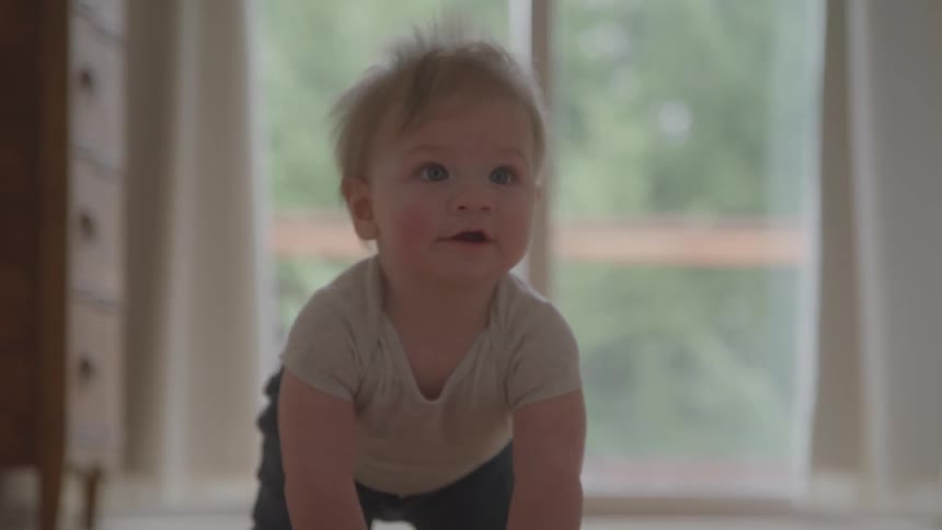 Smiling baby crawling