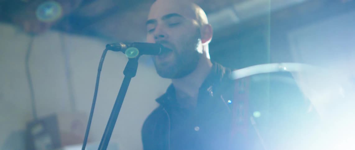 Man singing into a microphone