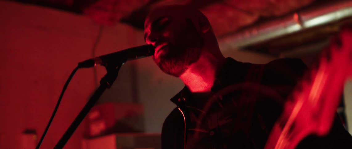 Man singing into a microphone