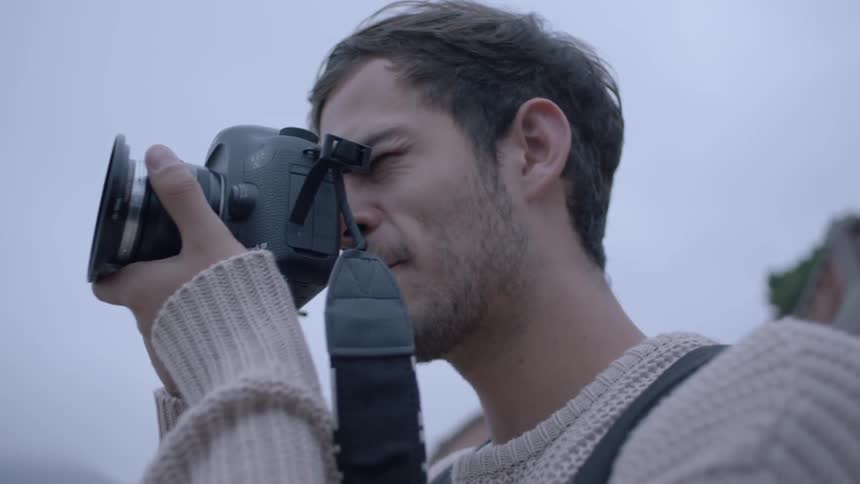 Man takes a picture of a city
