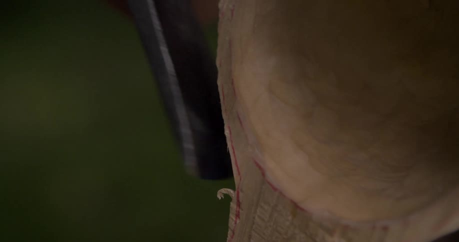 Wooden object being carved