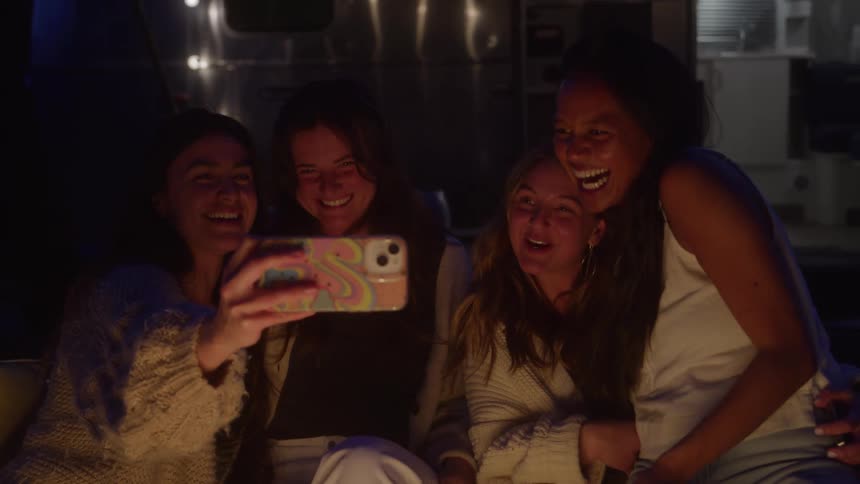 Friends taking selfies