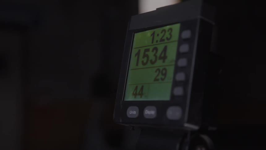 Close up of an electronic device displaying numerical readings on its screen