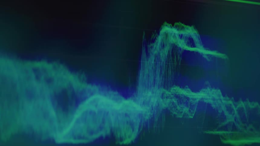 Green graph displaying wavy shapes on a dark screen