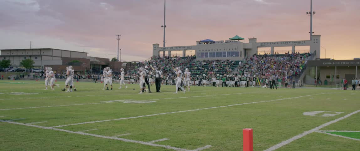 American football team warming up on the field