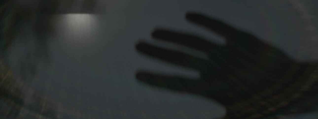 Hand moving through rings of light