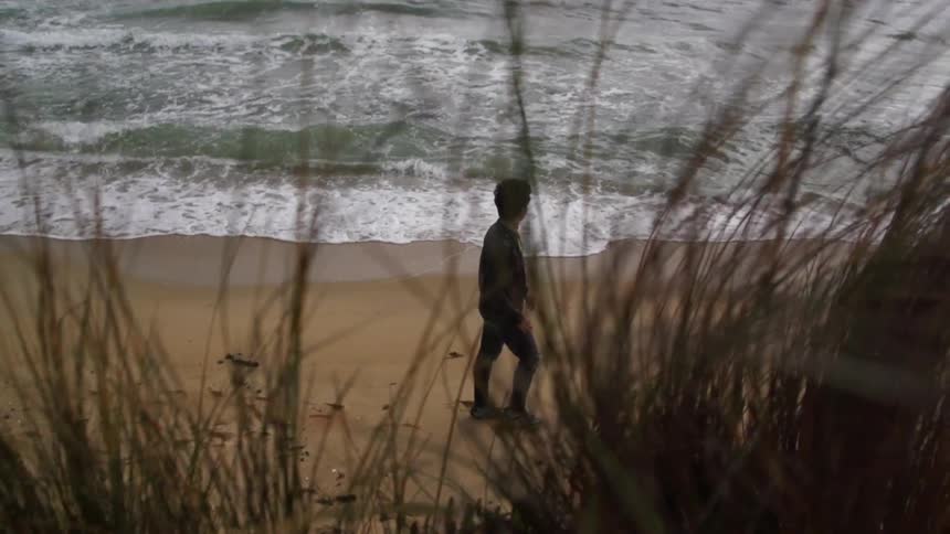 Man walking on a sandy beach