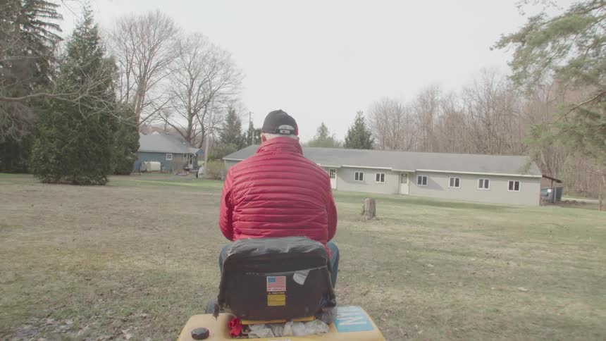 Man riding a lawnmower